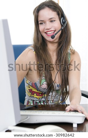 beautiful secretary at work talkin with headset