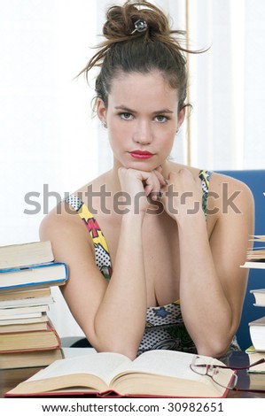 beautiful librarian woman or secretary at work with her books