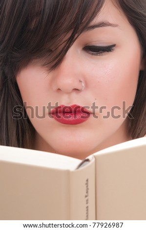beautiful woman reading a book in her bed