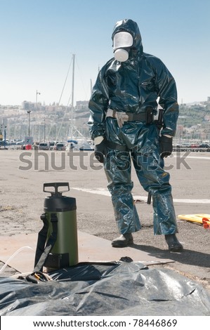 man with special ebola and virus dress or atomic contamination