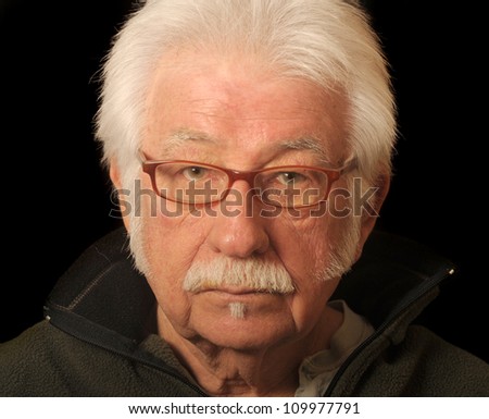 Portrait of an older man wearing glasses