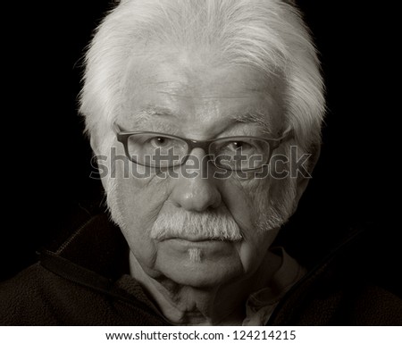 Artistic black and white portrait of a distinguished elderly man