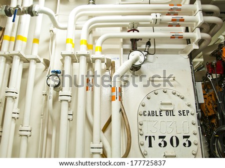 Piping connection Engine Room Spaces on a modern vessel - engineering interior including pipes, cables, pumps