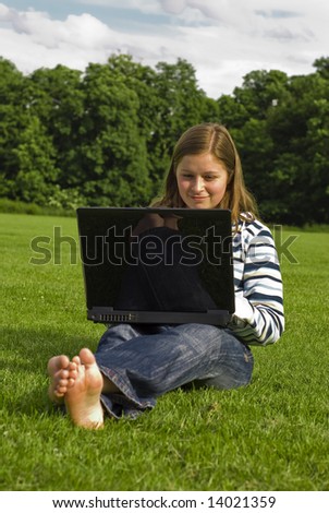 young woman with the laptop surfing on the internet