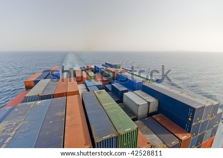 a large container vessel ship and the horizon, no logos in this picture