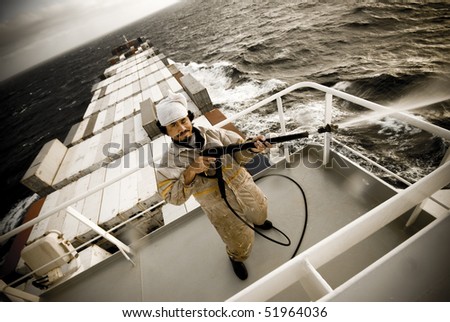crazy seaman at work onboard huge ship