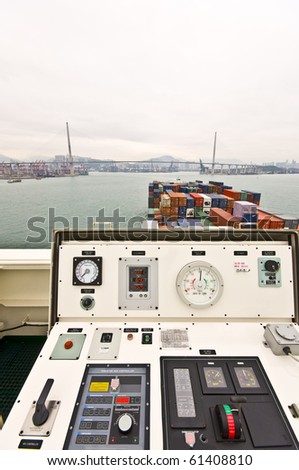 Large Container Vessel approaching Stone cutters Bridge, Hongkong, view from the Port Wing