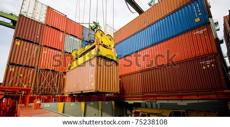 harbour crane lifts container during cargo operation in port harbour crane lifts container during cargo operation in port