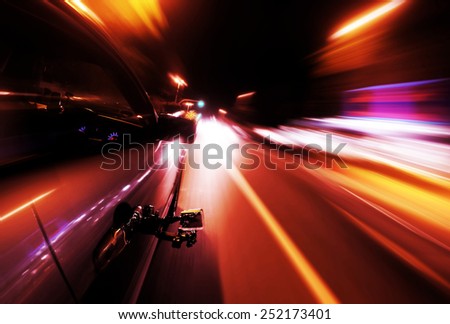 View on the camera recording from Side of Car Going Around Corner, Blurred Motion