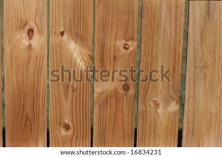 Wood fence with natural grain and knots for backgrounds