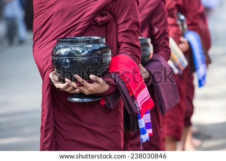 begging bowl in hand of monk