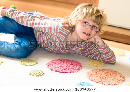 blond girl with blue eyes and glasses