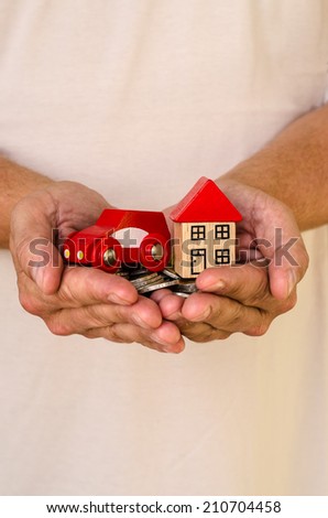 house and car on male hand image