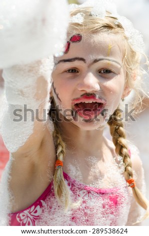 happy girl enjoying foam party