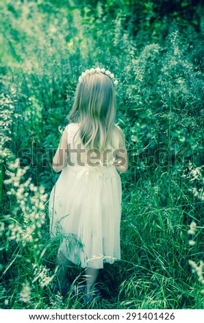 little forrest fairy with long hair back view filtered effect