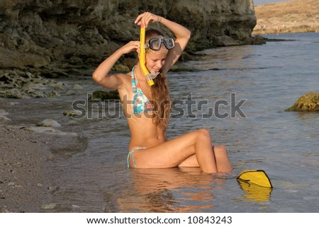 Girl in a diving mask and diving flippers