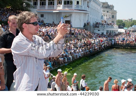 SEVASTOPOL, UKRAINE - JULY 29: People observe a naval review on Russian Navy Day on July 29, 2007 in Sevastopol, Ukraine.