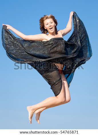 Barefoot girl in black skirt jumping and crying