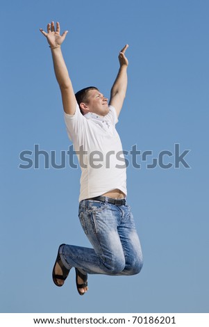Guy jumping. Young man jumping on background of sky