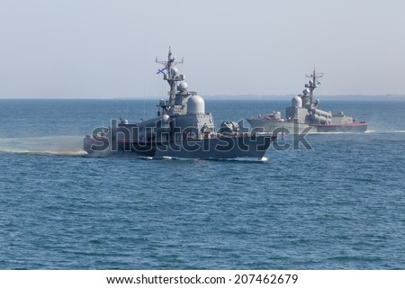 Two naval ships in the sea. Russian Naval ships on Day of Russian Navy in Sevastopol (Crimea)
