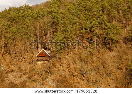 Small cottage in mountain forests.