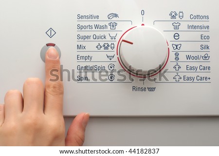 Pushing the power button of washing machine
