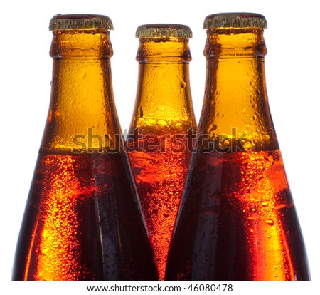 Three amber bottles with beer isolated on white background