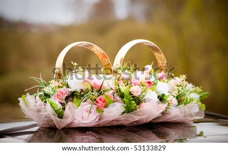 stock photo Wedding symbols bunch of flowers and couple of rings