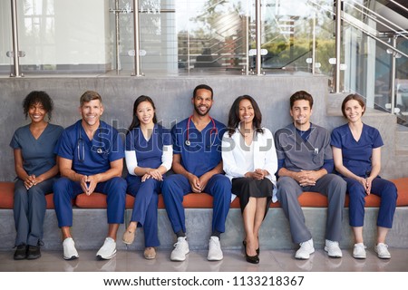 Healthcare workers sitting together in a modern hospital