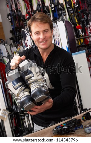Sales Assistant With Ski Boots In Hire Shop