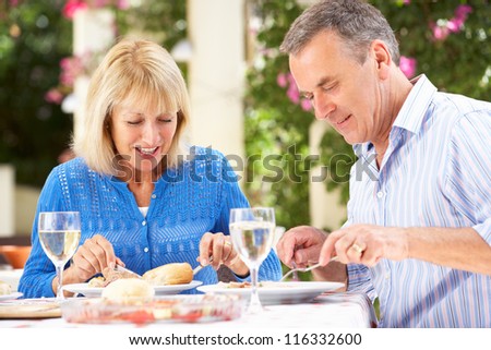 Senior Couple Enjoying Meal outdoorss
