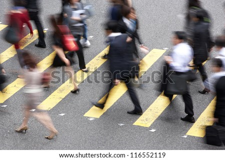 Overhead View Of Commuters Crossing Busy Hong Kong Street