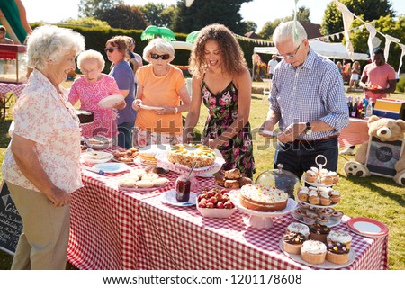 Busy Cake Stall At Summer Garden Fete