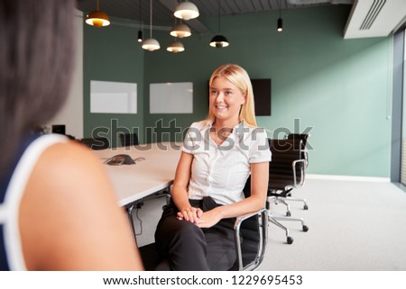 Businesswoman Interviewing Female Candidate At Graduate Recruitment Assessment Day In Office