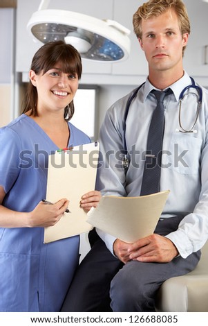 Portrait Of Doctor And Nurse In Doctor\'s Office