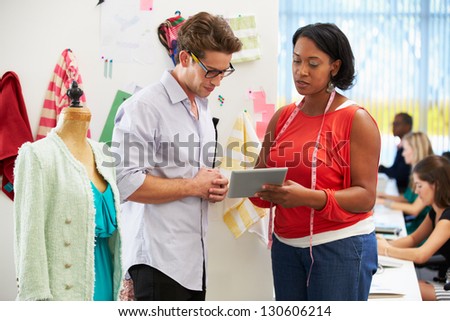 Man And Woman Meeting In Fashion Design Studio