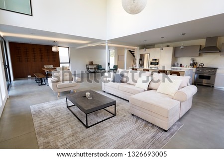 Seating Area And Kitchen In Stylish And Contemporary Empty Home