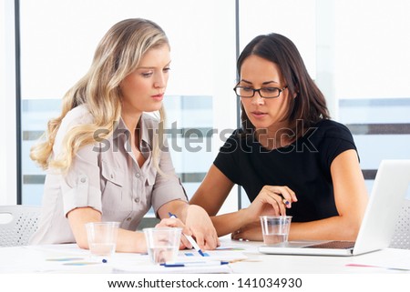 Two Businesswomen Meeting In Office