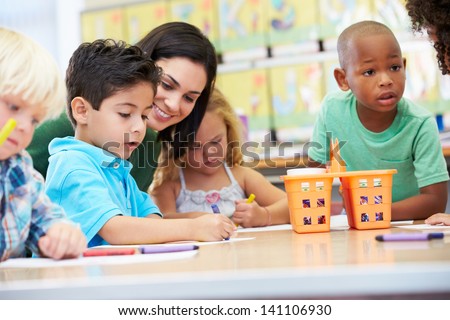 Group Of Elementary Age Children In Art Class With Teacher Group Of Elementary Age Children In Art Class With Teacher
