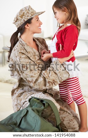 Daughter Greeting Military Mother Home On Leave