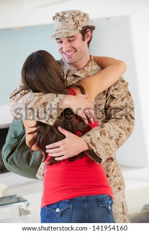 Wife Greeting Military Husband Home On Leave