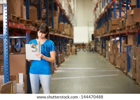 Female Worker In Distribution Warehouse