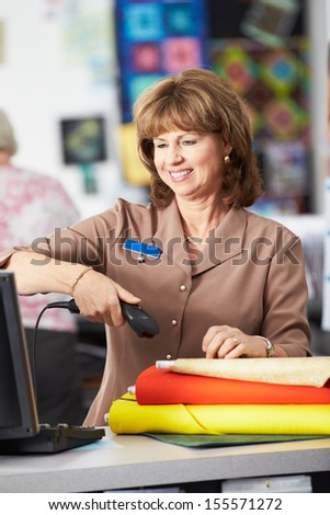 Female Cashier At Clothing Store