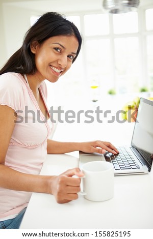 Indian Woman Using Laptop At Home