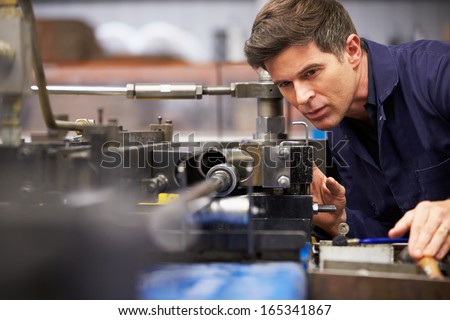 Factory Engineer Operating Hydraulic Tube Bender