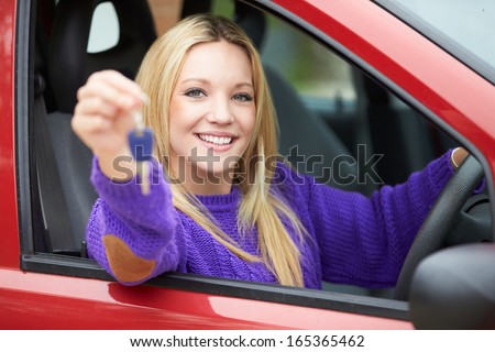 Teenage Girl Standing Next To Car Holding Key