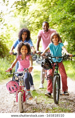 African American Family On Cycle Ride In Countryside