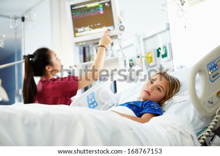 Young Girl With Female Nurse In Intensive Care Unit
