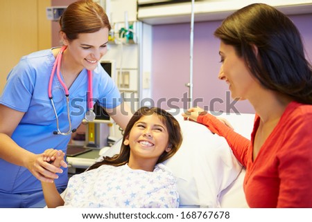 Mother And Daughter Talking To Female Nurse In Hospital Room
