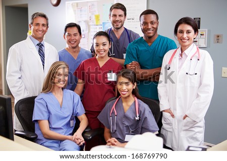 Portrait Of Medical Team At Nurses Station
